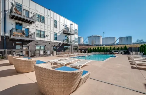 a view of a swimming pool with a patio
