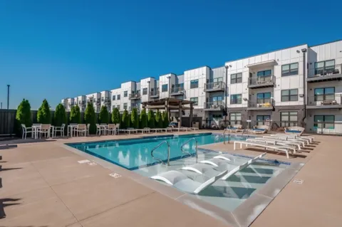 a view of a swimming pool and a chairs