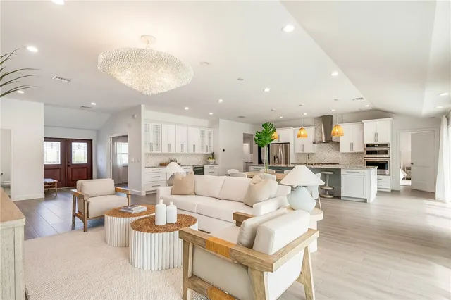 a bedroom with a bed and white cabinets