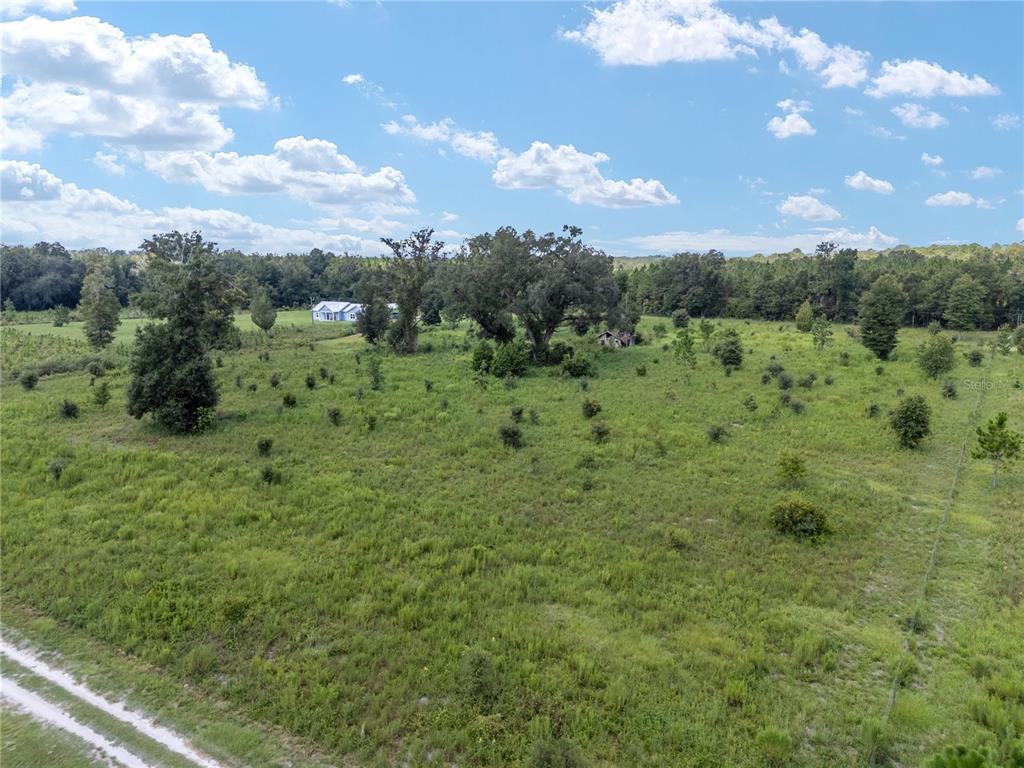 Tbd Northwest 264th Way High Springs, FL 32643 - Photo 7 of 16 a view of a green field