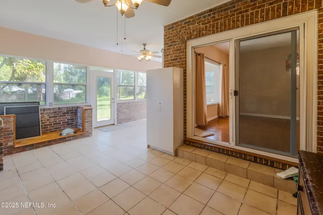 a view of a room with a large window