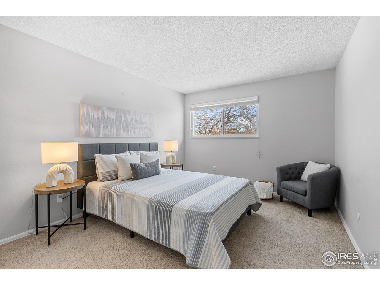 1170 Monroe Drive, Unit C Boulder, CO 80303 - Photo 8 of 14 a bedroom with a bed and a couch