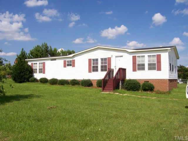 8317 Creek Road Willow Spring, NC 27592 - Photo 1 of 1 a view of a house with backyard