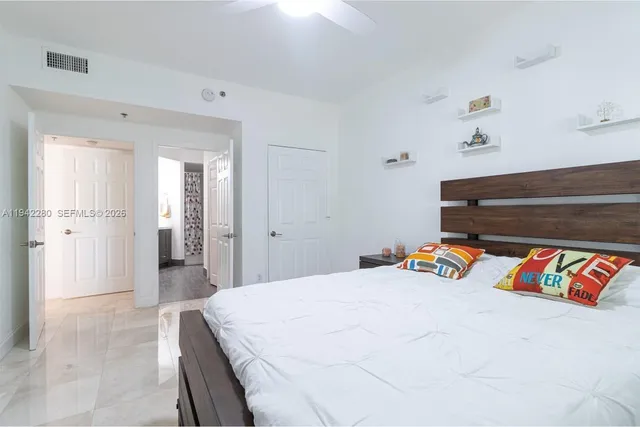 a bedroom with a bed and a book shelf