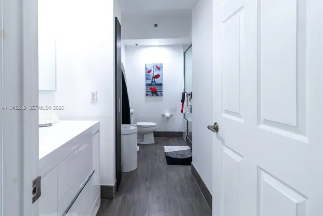 a bathroom with a sink a toilet and a bathtub