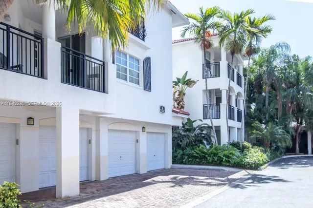 a view of a yard with large trees