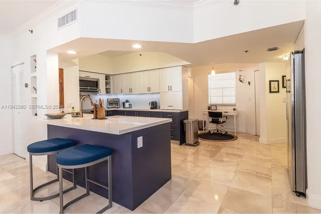 a kitchen with a sink cabinets and window