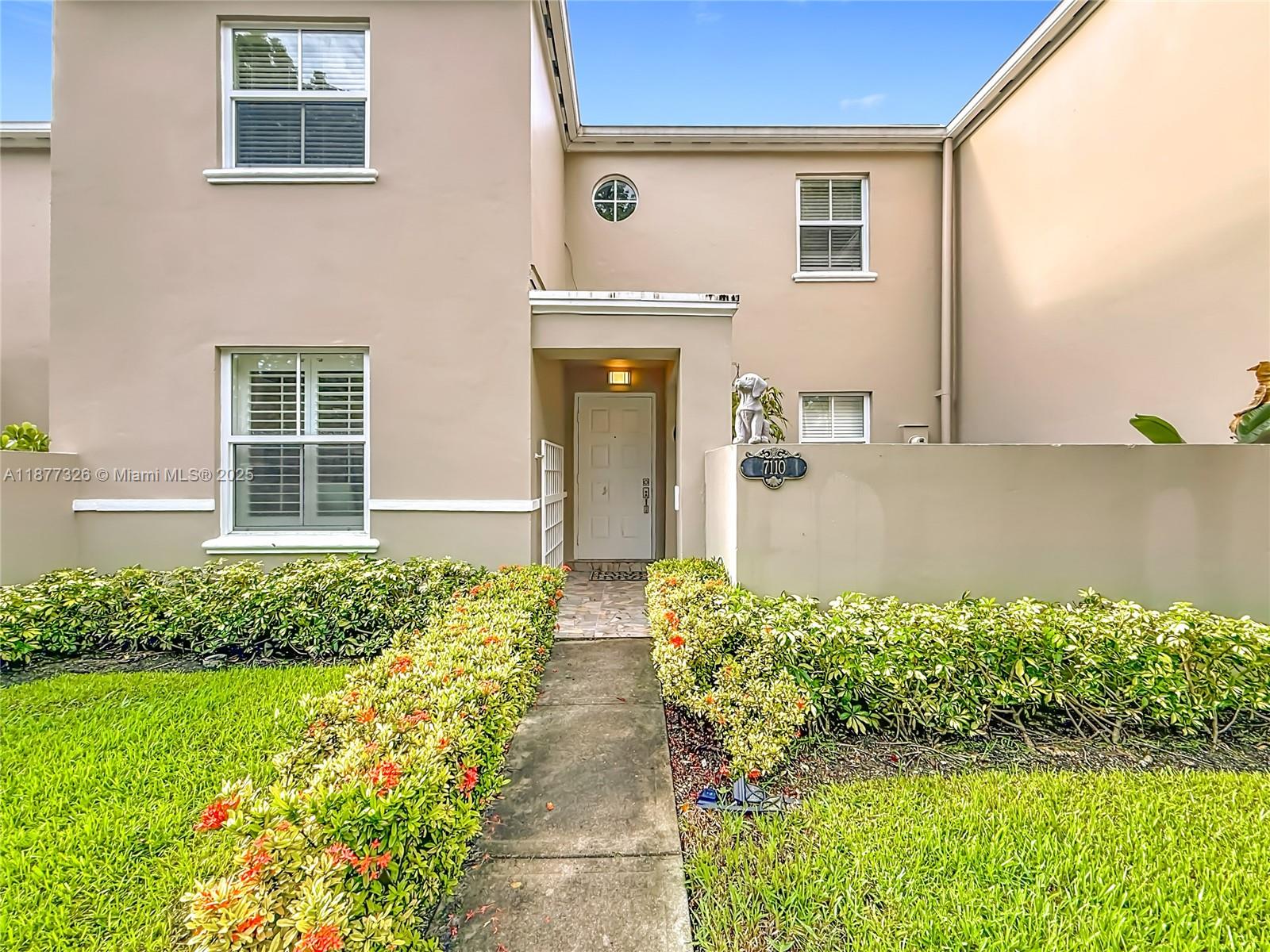 7110 Southwest 54th Street Miami, FL 33155 - Photo 1 of 40 a front view of a house with a yard