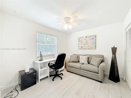 a living room with furniture and a window