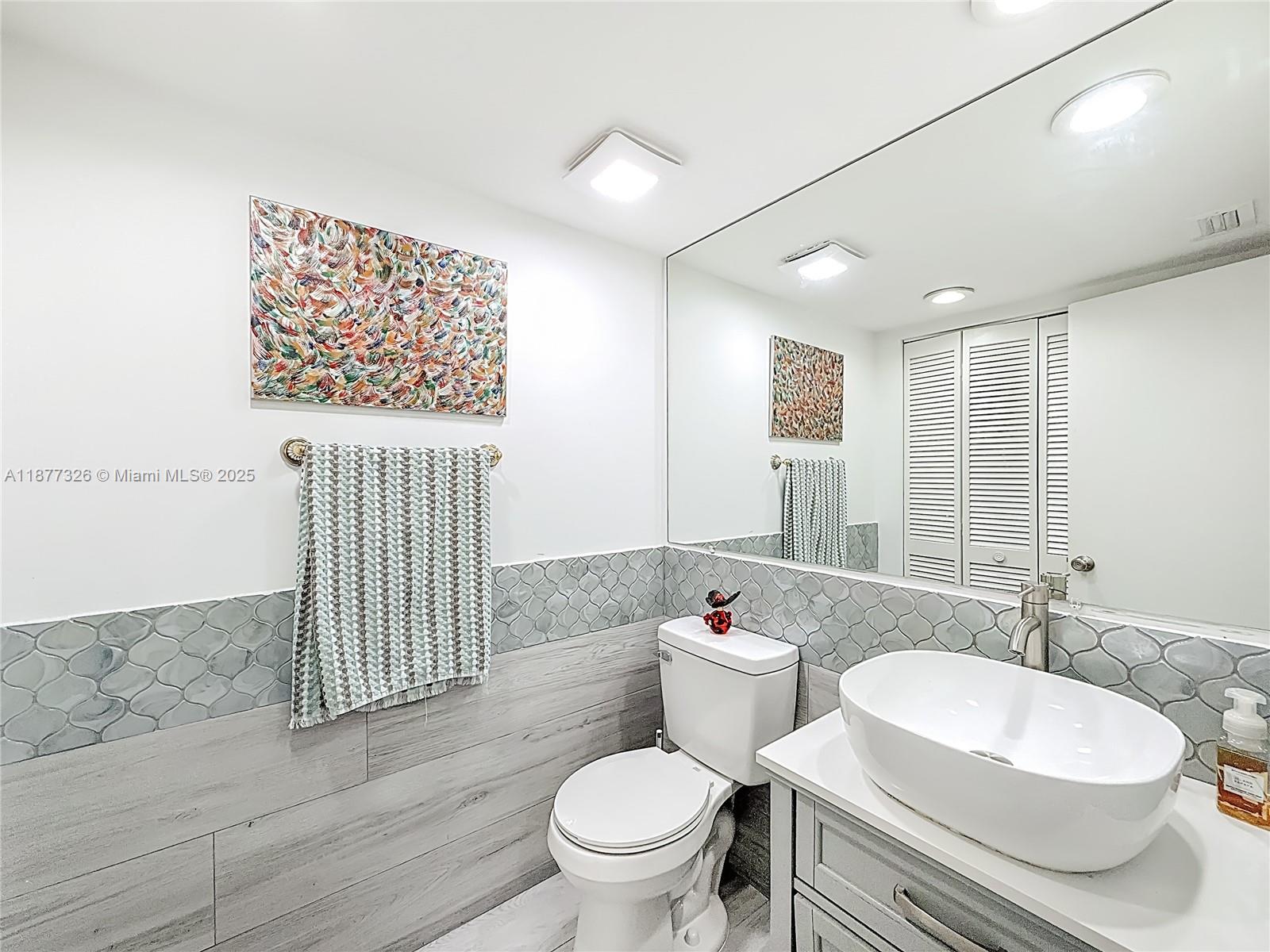 7110 Southwest 54th Street Miami, FL 33155 - Photo 15 of 40 a bathroom with a sink toilet and shower