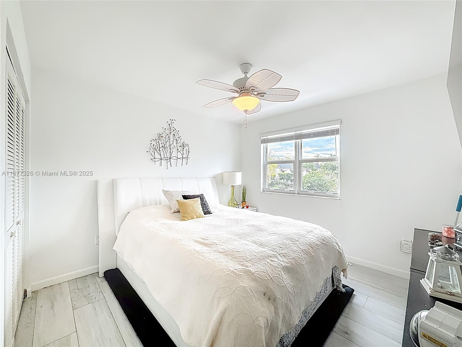 7110 Southwest 54th Street Miami, FL 33155 - Photo 19 of 40 a bedroom with a bed and a window