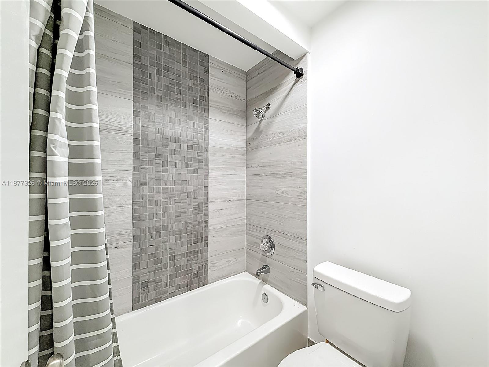 7110 Southwest 54th Street Miami, FL 33155 - Photo 21 of 40 a bathroom with a toilet and shower