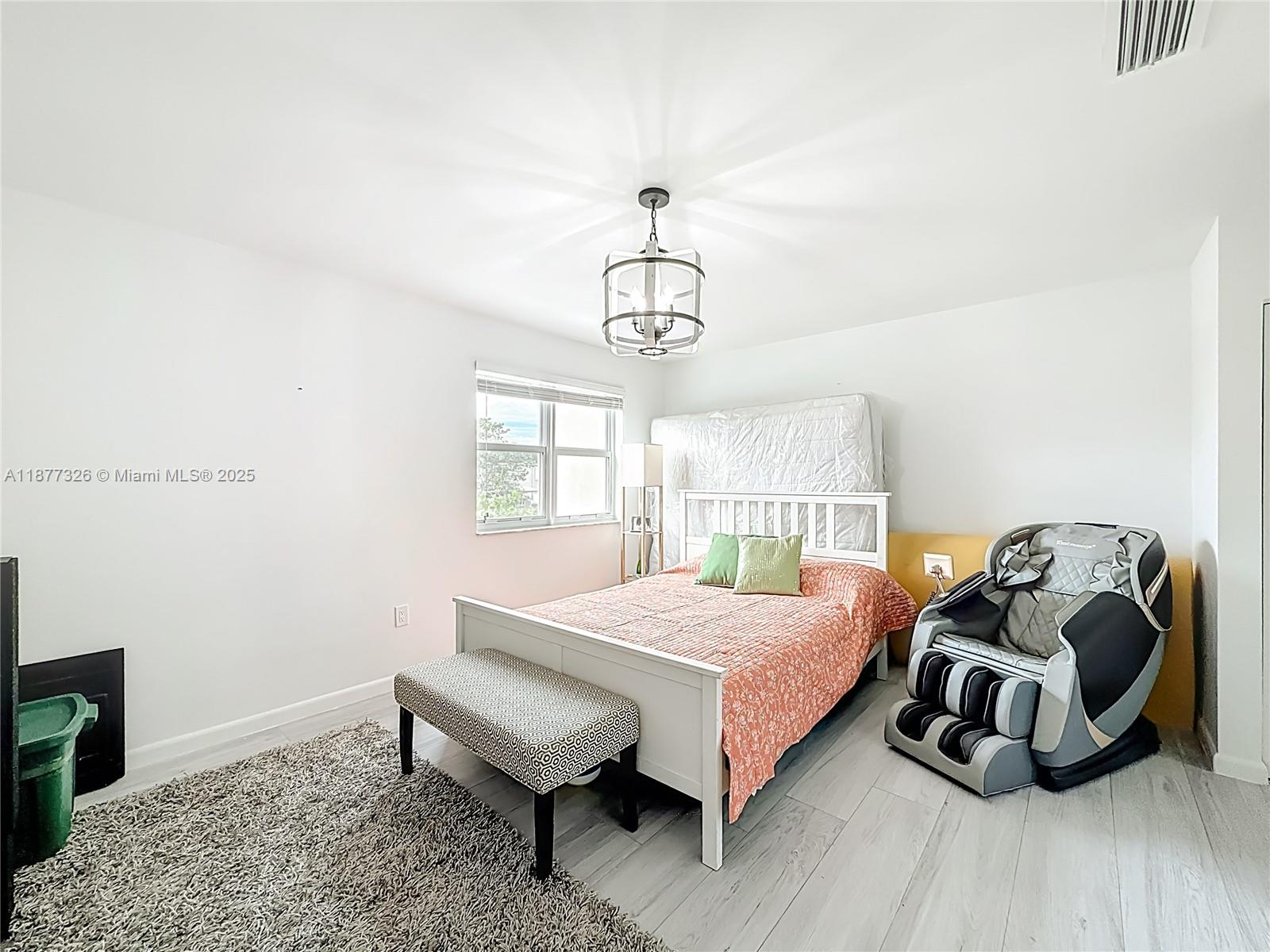 7110 Southwest 54th Street Miami, FL 33155 - Photo 23 of 40 a bedroom with a bed and a window