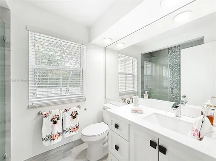 a bathroom with a sink toilet and a bathtub