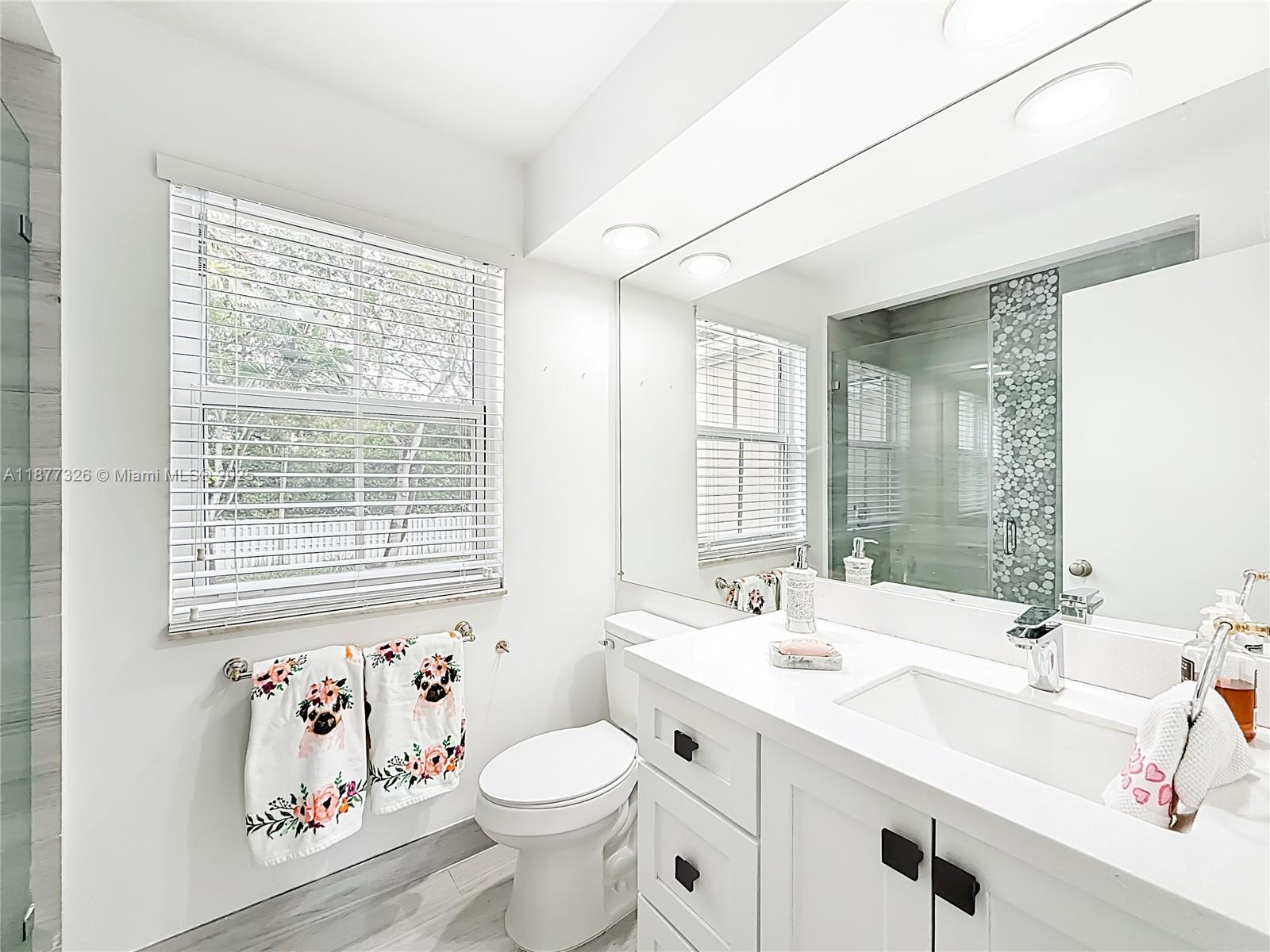 7110 Southwest 54th Street Miami, FL 33155 - Photo 25 of 40 a bathroom with a sink toilet and a bathtub