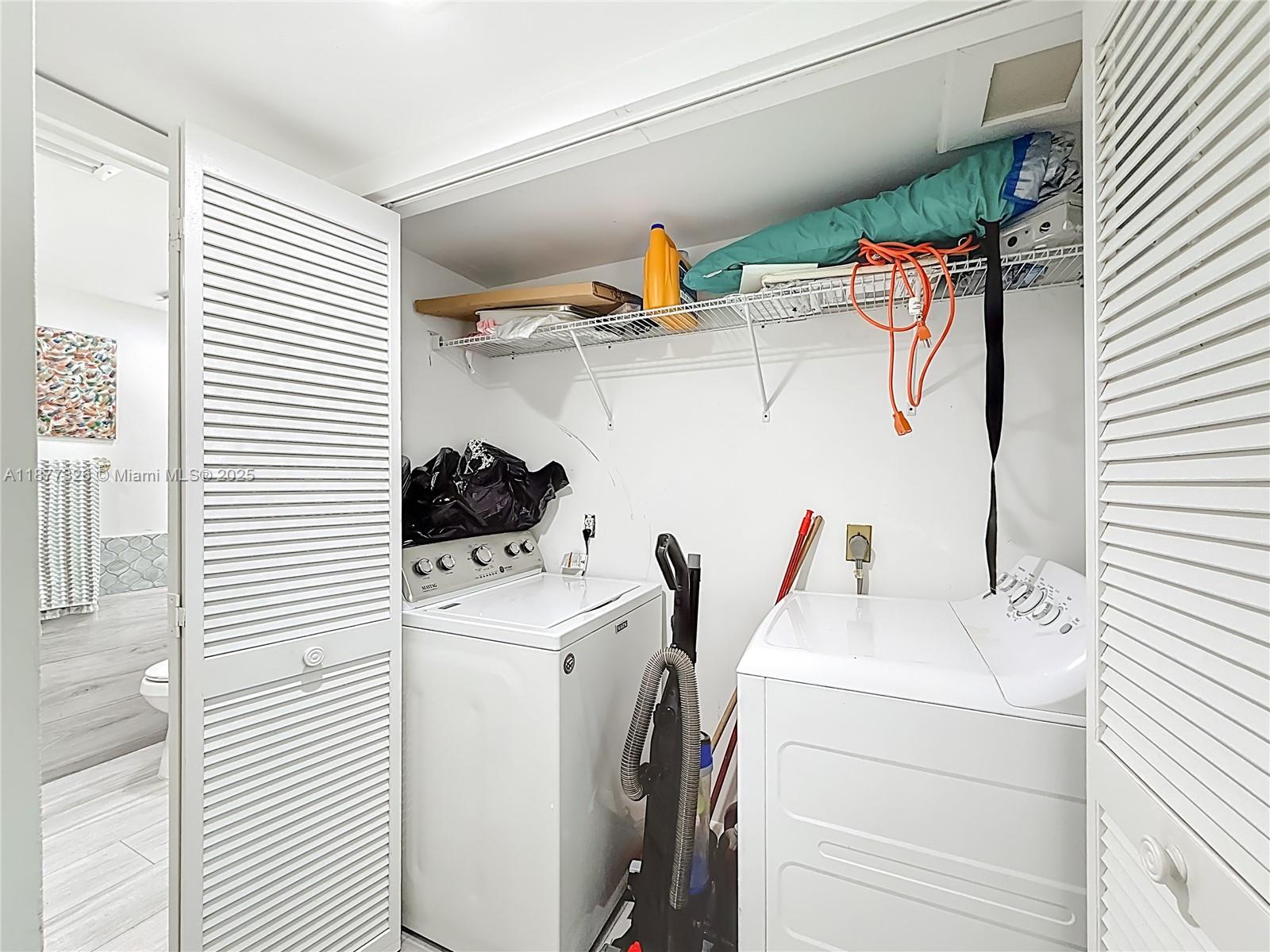 7110 Southwest 54th Street Miami, FL 33155 - Photo 27 of 40 a utility room with dryer and washer