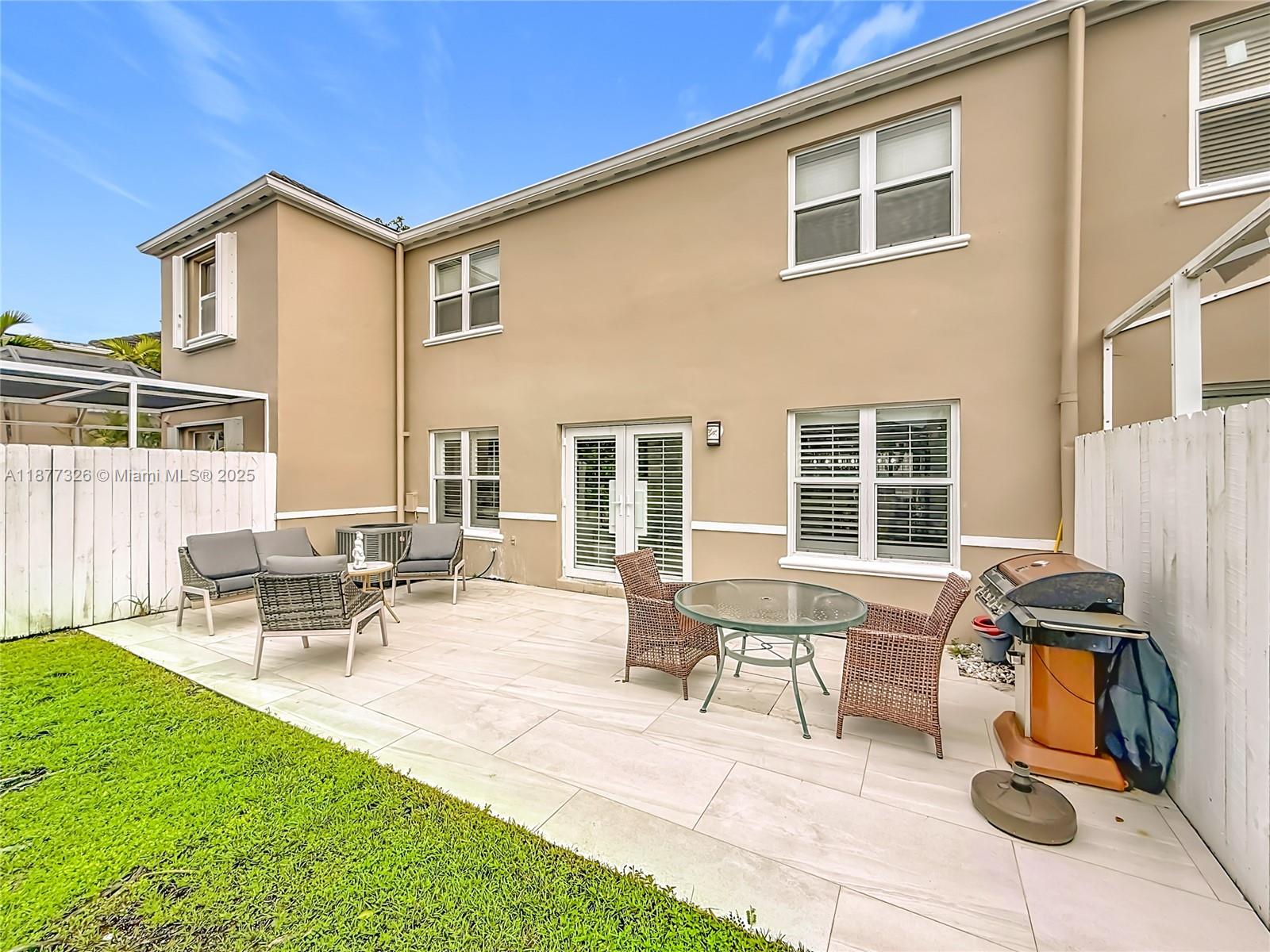 7110 Southwest 54th Street Miami, FL 33155 - Photo 30 of 40 a view of a house with backyard and sitting area