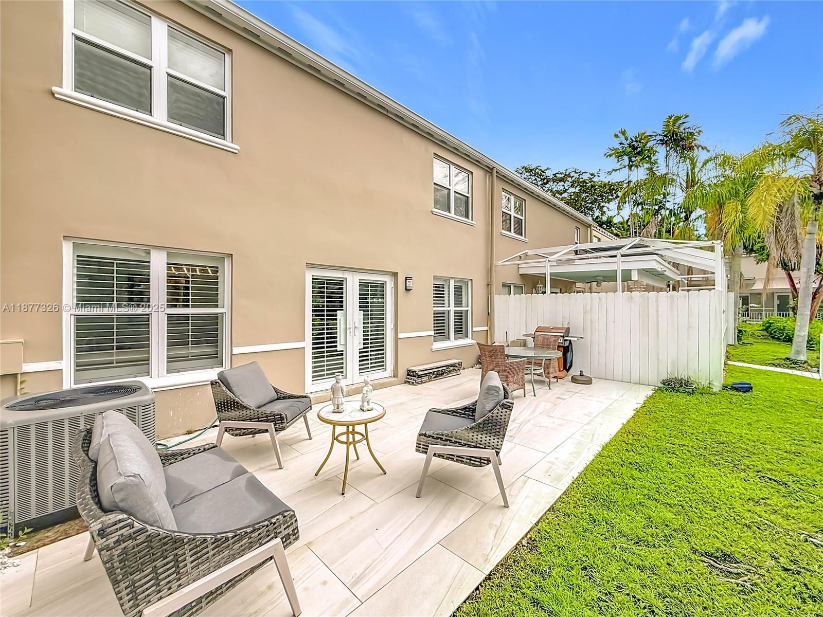 7110 Southwest 54th Street Miami, FL 33155 - Photo 31 of 40 a view of a house with backyard sitting area and garden