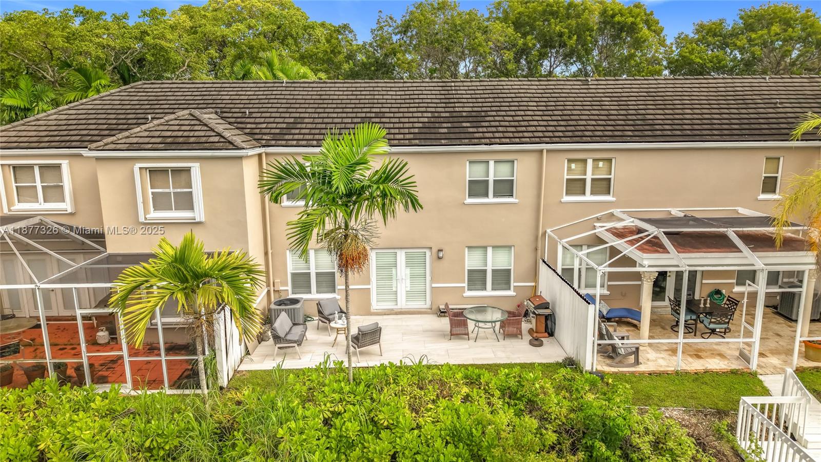 7110 Southwest 54th Street Miami, FL 33155 - Photo 32 of 40 a front view of a house with a yard