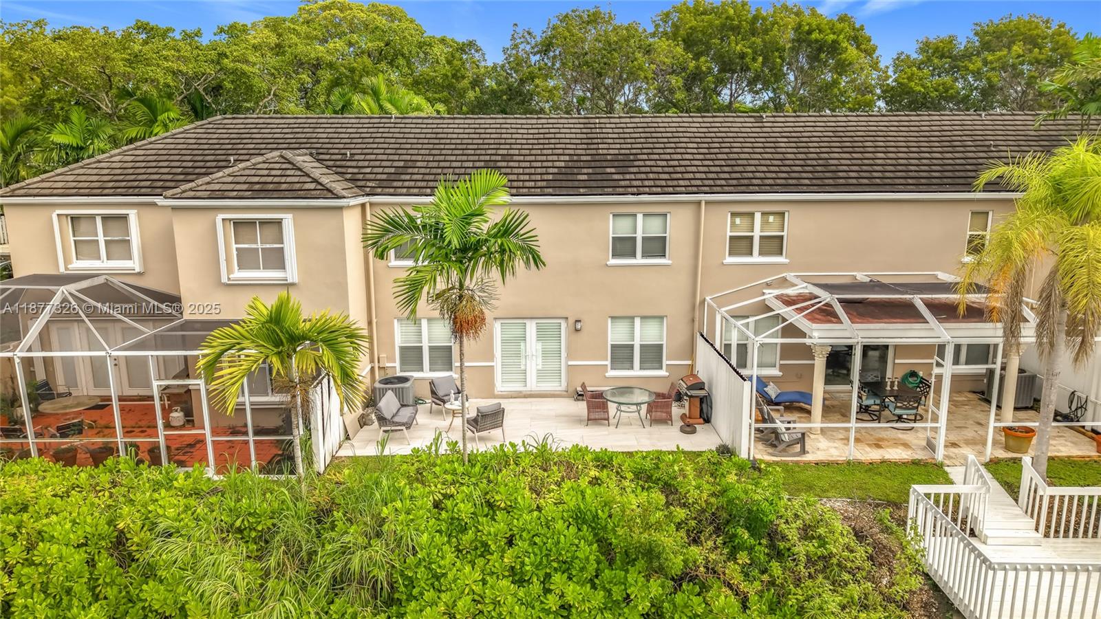 7110 Southwest 54th Street Miami, FL 33155 - Photo 33 of 40 a front view of a house with a yard table and chairs