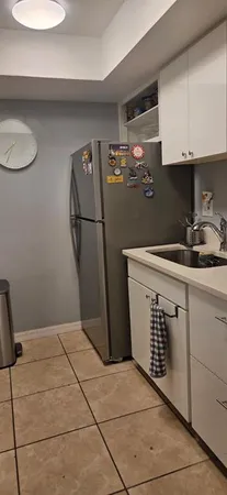 a kitchen with a sink cabinets and appliances
