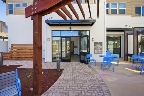 a view of a building with sitting area