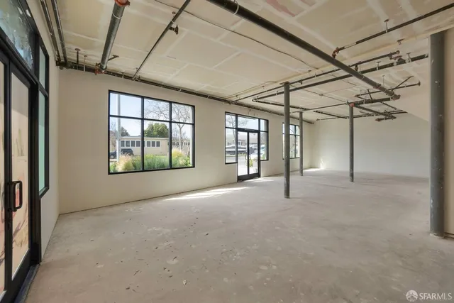 a view of large room with windows