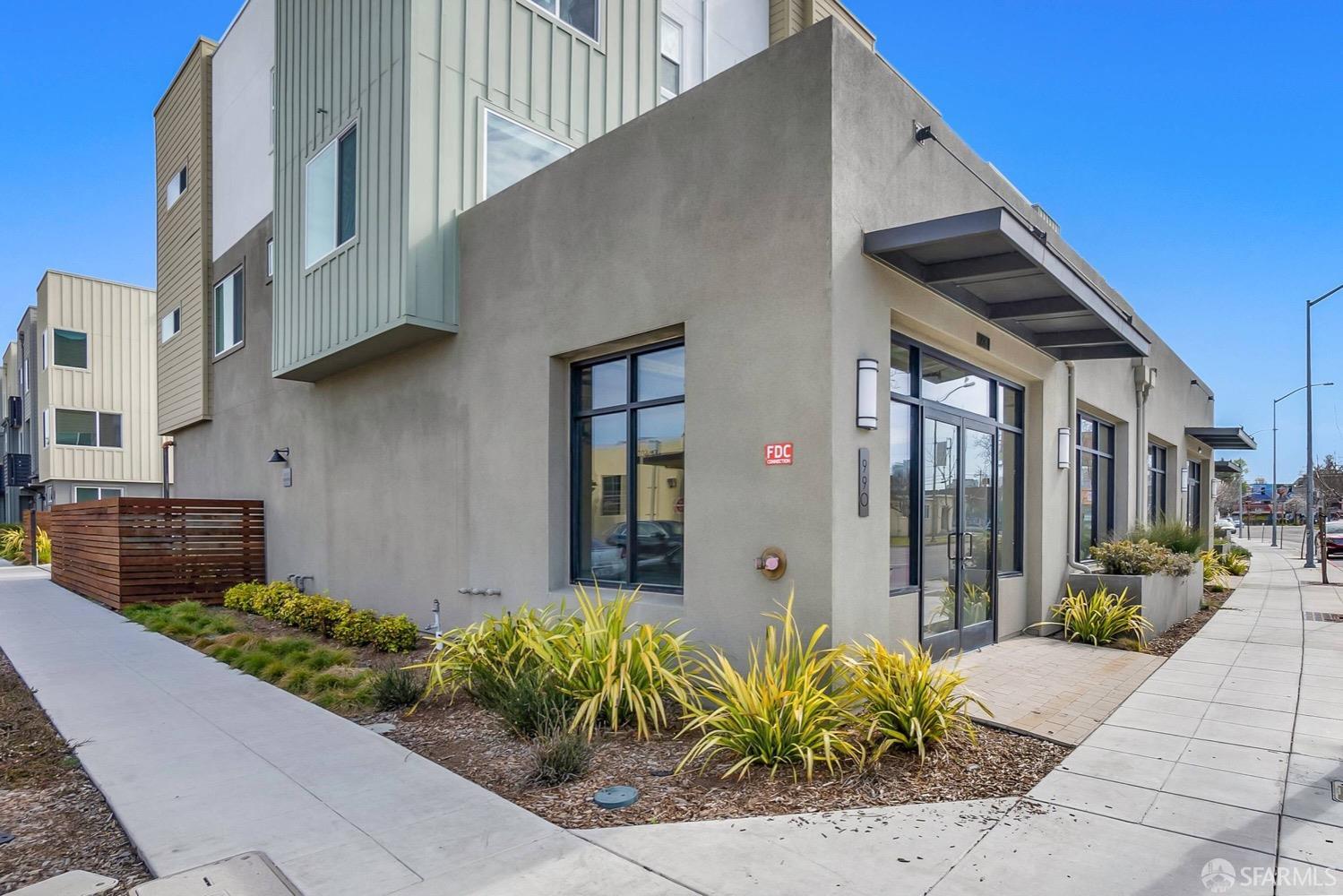 990 West Grand Avenue Oakland, CA 94607 - Photo 6 of 10 a front view of a house with garden