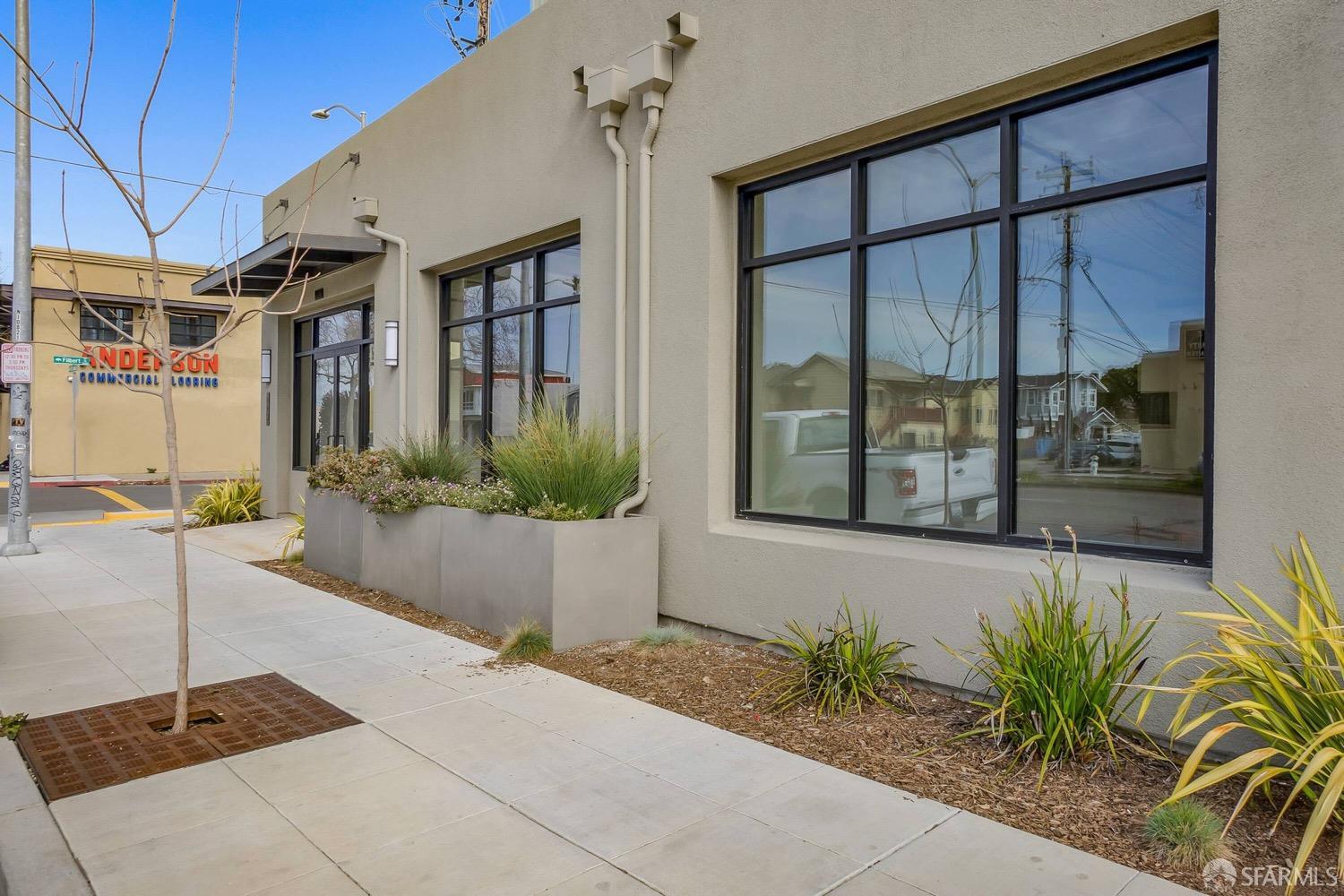 990 West Grand Avenue Oakland, CA 94607 - Photo 8 of 10 a front view of a house with a yard