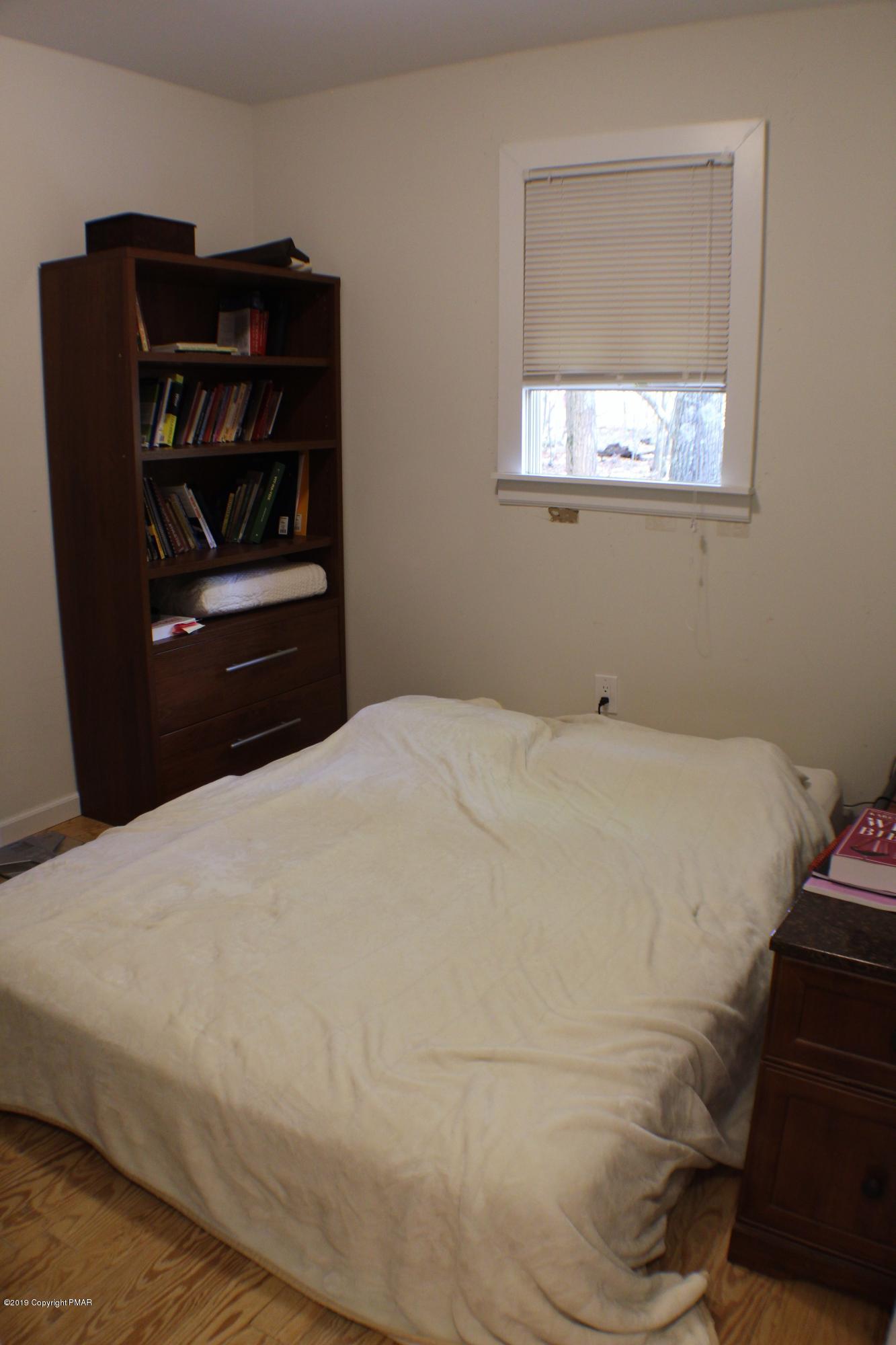 154 Morris Road East Stroudsburg, PA 18302 - Photo 14 of 17 a bedroom with a bed and window