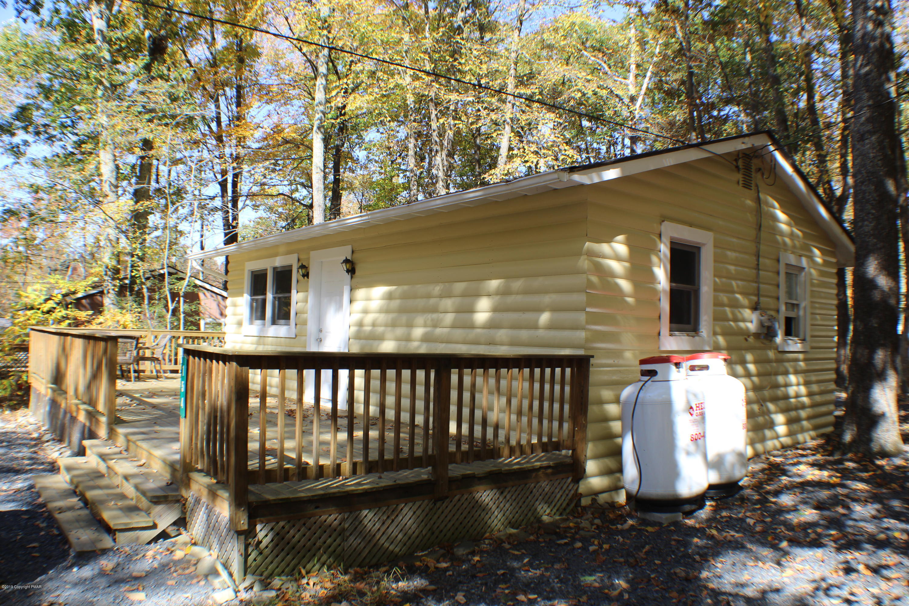154 Morris Road East Stroudsburg, PA 18302 - Photo 2 of 17 a view of a patio with a table and chairs