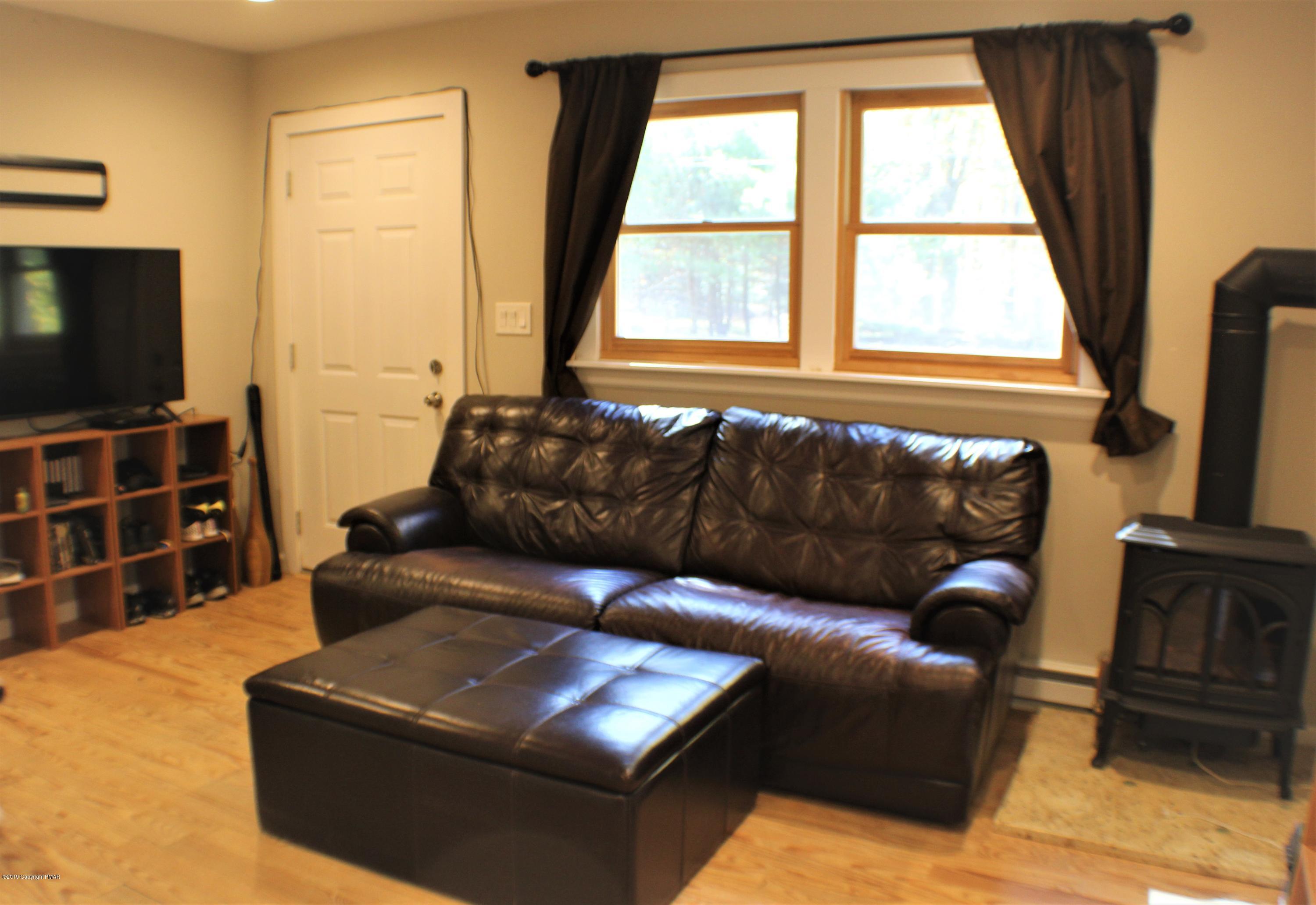154 Morris Road East Stroudsburg, PA 18302 - Photo 7 of 17 a living room with furniture and a flat screen tv