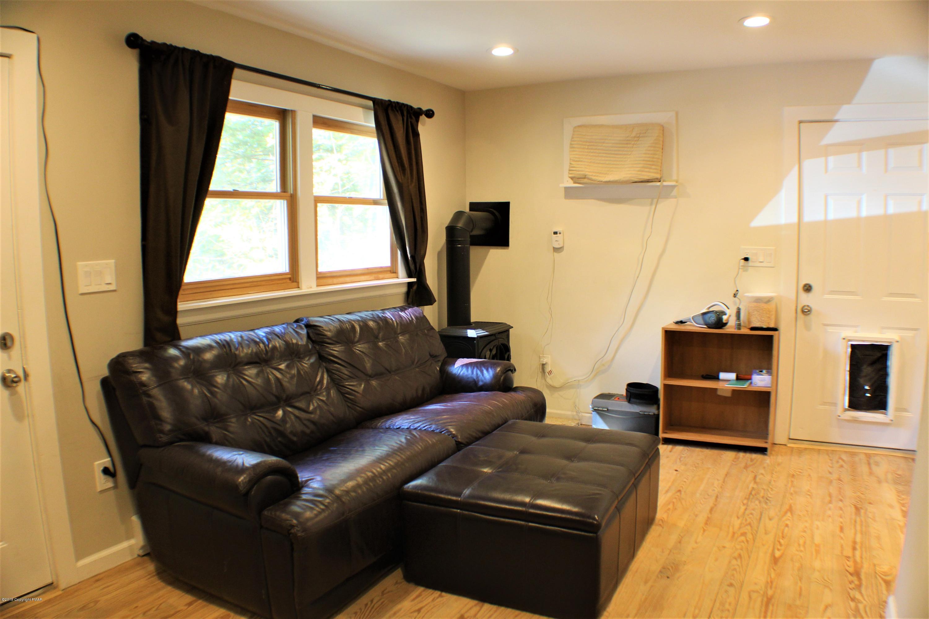 154 Morris Road East Stroudsburg, PA 18302 - Photo 8 of 17 a living room with furniture and a flat screen tv