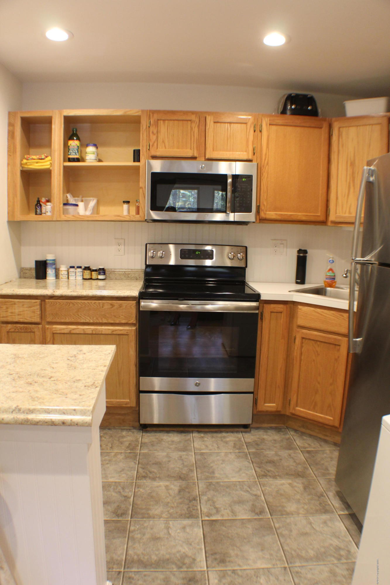 154 Morris Road East Stroudsburg, PA 18302 - Photo 10 of 17 a kitchen with stainless steel appliances granite countertop a stove a sink and a microwave