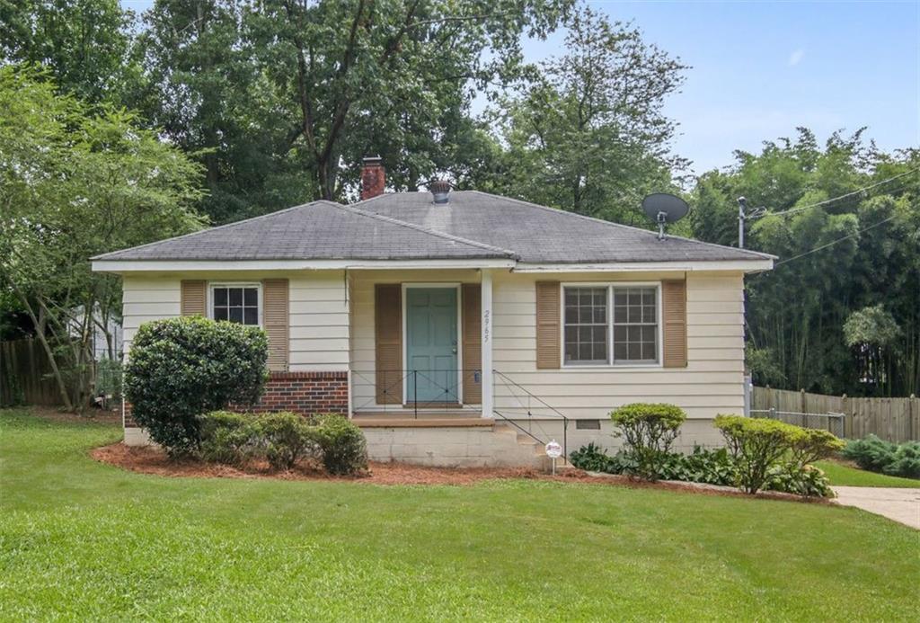2965 Lowrance Drive Decatur, GA 30033 - Photo 1 of 1 a front view of a house with a garden