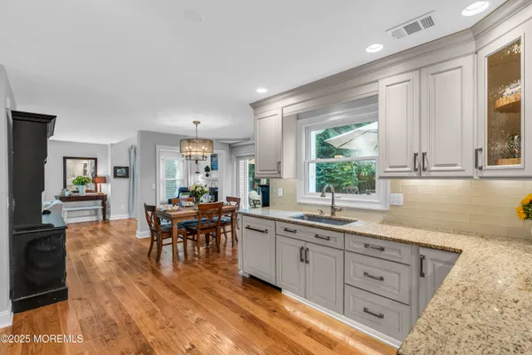 a view of a kitchen counter space and a sink