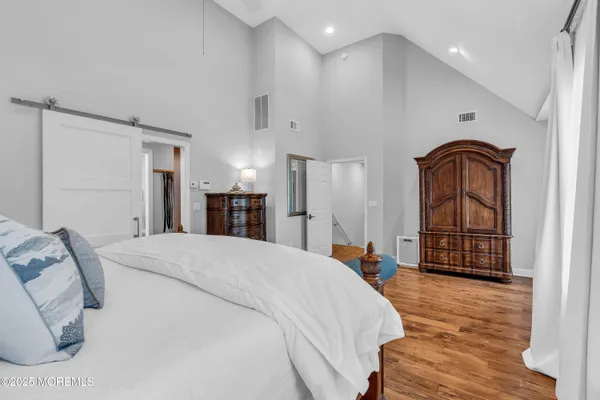 a bed room with a bed and a dresser