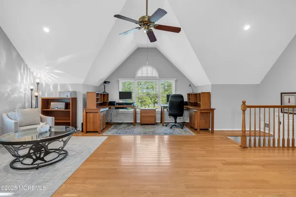 a living room with furniture fireplace and a view of kitchen