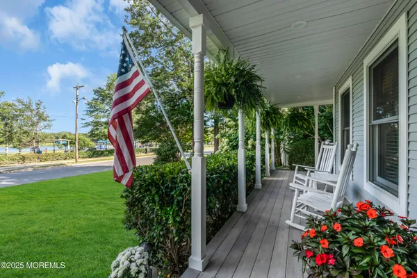 a house view with a sitting space and garden space