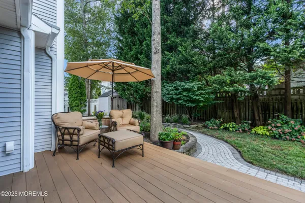 a view of a table and chairs under an umbrella