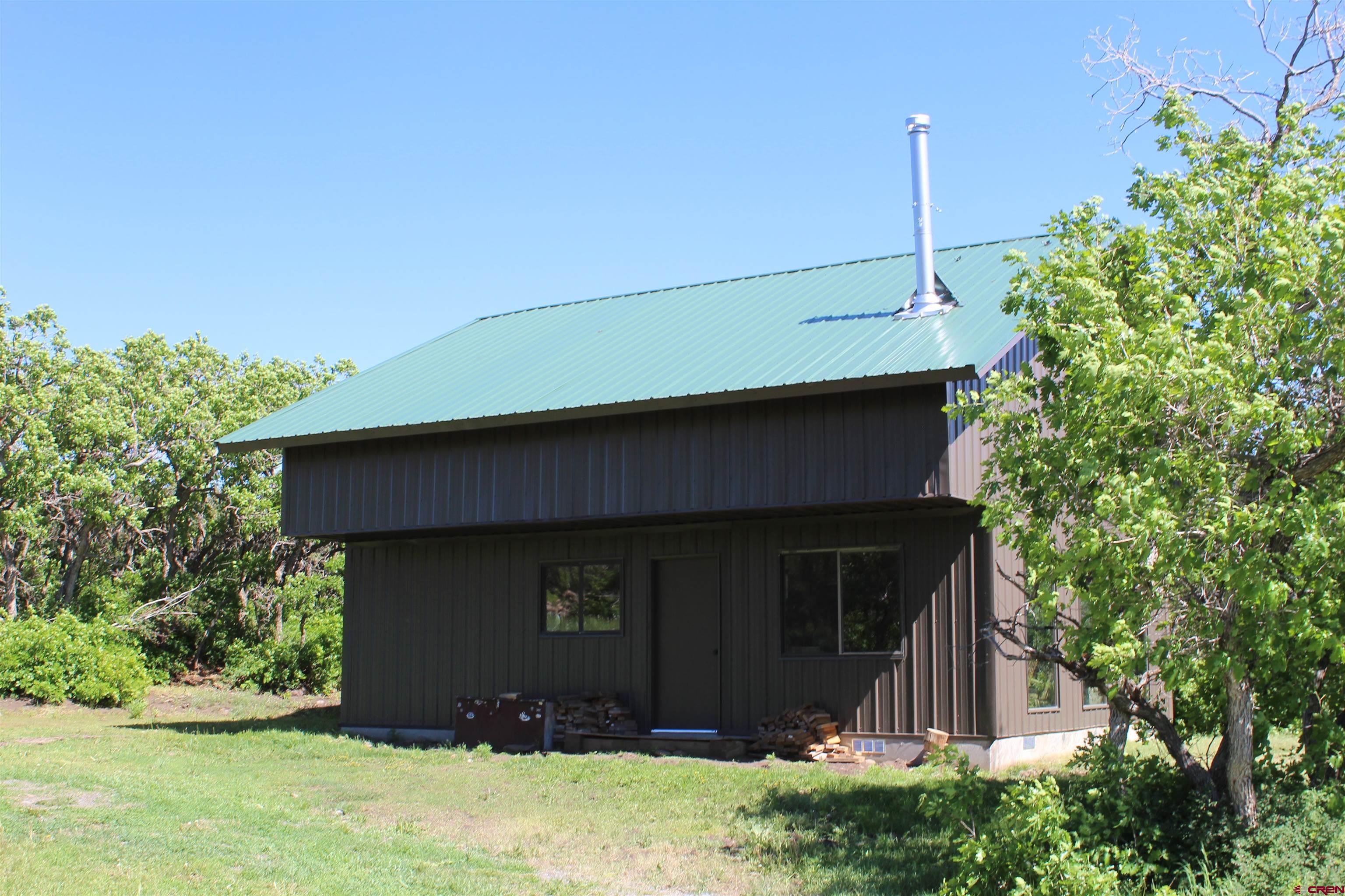 13 West Elk View Cedaredge, CO 81413 - Photo 3 of 31 a front view of a house with a yard