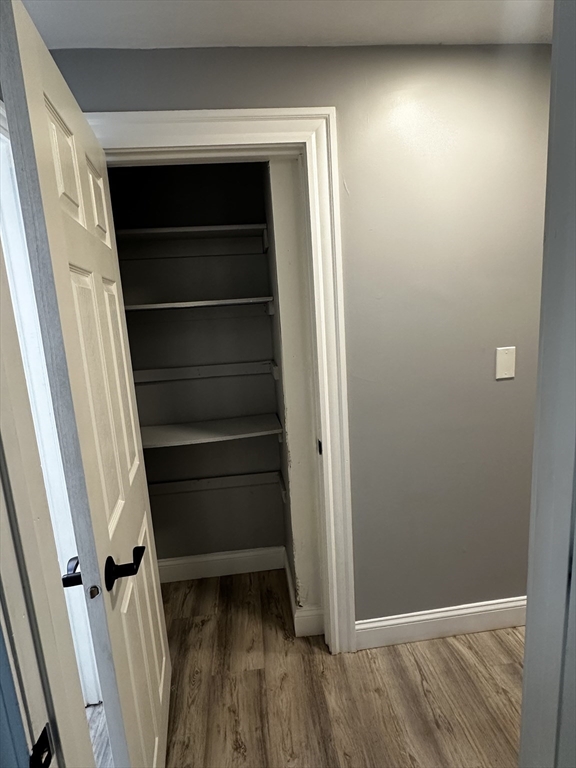 215 Belmont Avenue, Unit 1 Brockton, MA 02301 - Photo 15 of 30 a view of walk in closet with empty racks