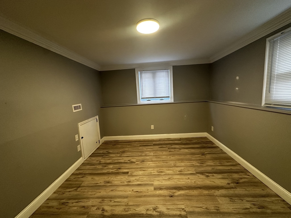 215 Belmont Avenue, Unit 1 Brockton, MA 02301 - Photo 23 of 30 a view of a room with an empty space