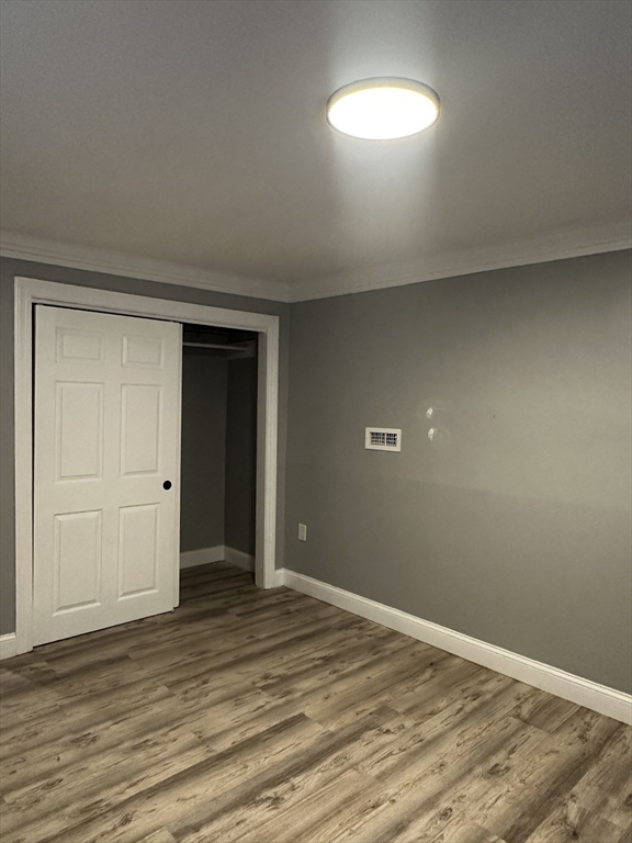 215 Belmont Avenue, Unit 1 Brockton, MA 02301 - Photo 24 of 30 a view of a room with wooden floor and window