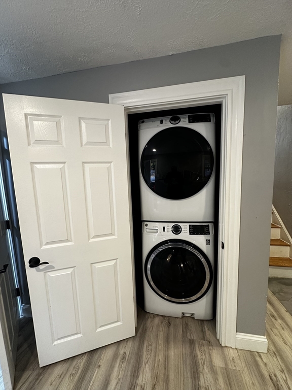 215 Belmont Avenue, Unit 1 Brockton, MA 02301 - Photo 28 of 30 a view of a hallway with washer and dryer