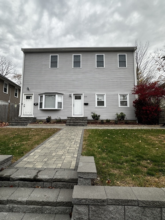 215 Belmont Avenue, Unit 1 Brockton, MA 02301 - Photo 29 of 30 a front view of a house with a yard