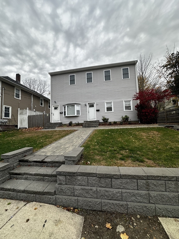 215 Belmont Avenue, Unit 1 Brockton, MA 02301 - Photo 30 of 30 a front view of a house with garden