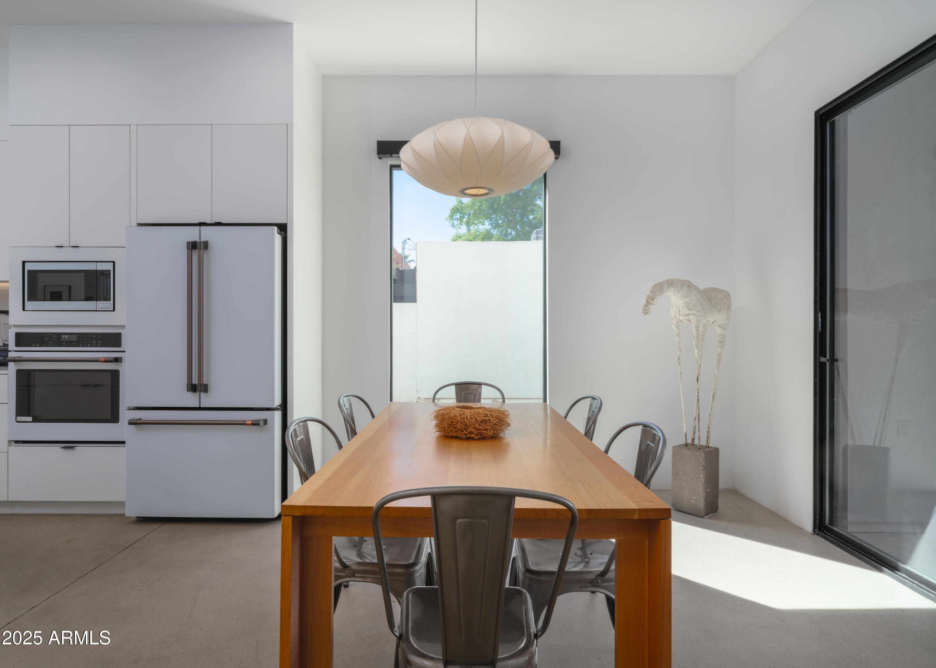 1526 East Coronado Road Phoenix, AZ 85006 - Photo 12 of 39 a kitchen with stainless steel appliances granite countertop a refrigerator a microwave a sink and white cabinets
