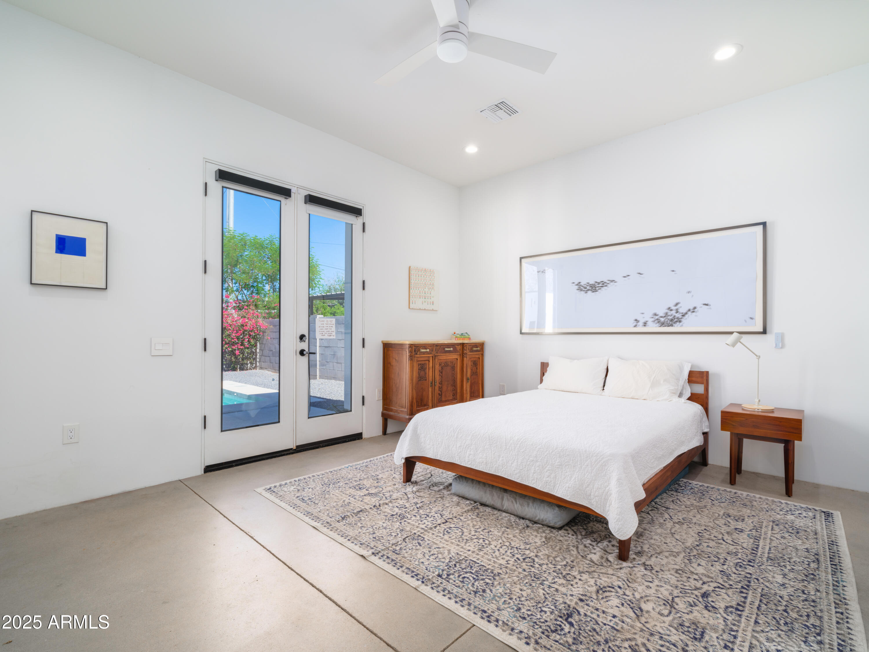 1526 East Coronado Road Phoenix, AZ 85006 - Photo 14 of 39 a spacious bedroom with a bed and a view of bathroom
