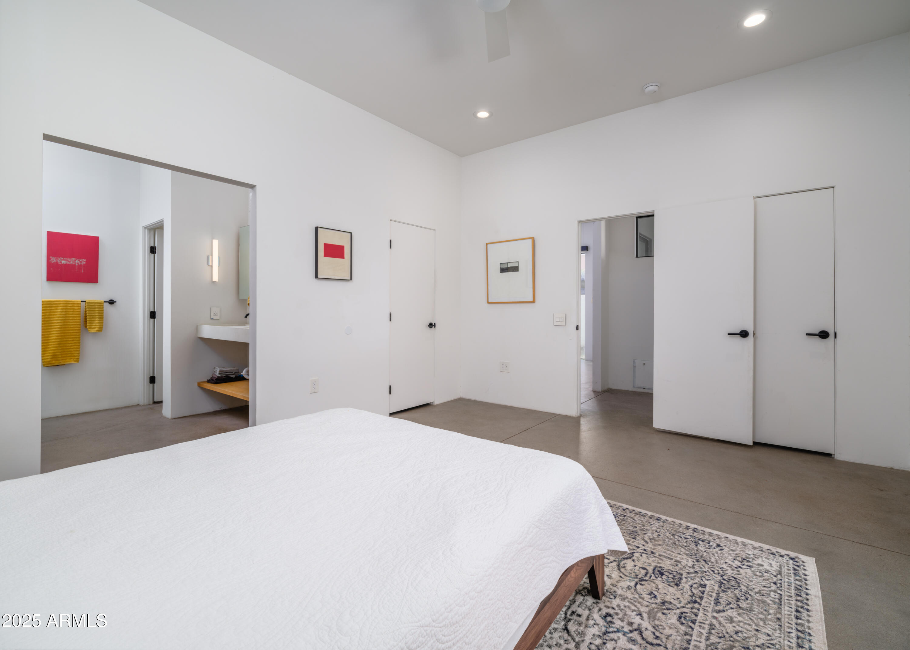 1526 East Coronado Road Phoenix, AZ 85006 - Photo 22 of 39 a spacious bedroom with a bed and a cabinets